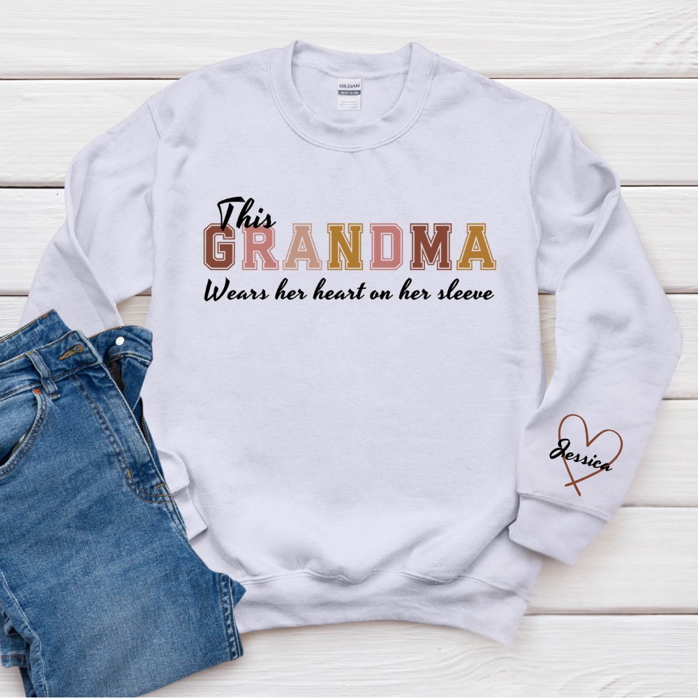 This Grandma Wears Her Heart On Her Sleeve - Family Personalized Custom Unisex Sweatshirt With Design On Sleeve - Gift For Mom, Grandma