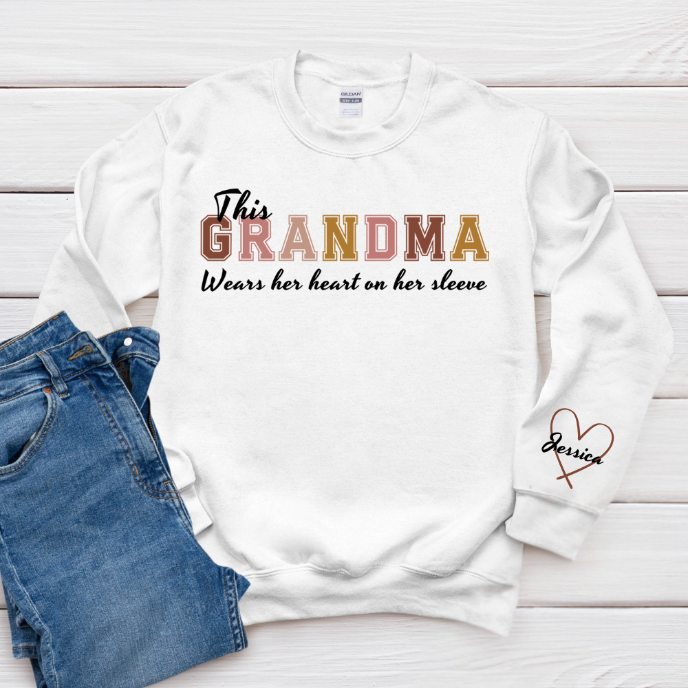 This Grandma Wears Her Heart On Her Sleeve - Family Personalized Custom Unisex Sweatshirt With Design On Sleeve - Gift For Mom, Grandma